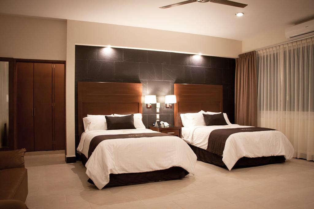 Hotel Ecce Inn & Spa Silao Værelse billede A bedroom at the hotel